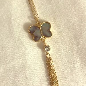 Pearly grey shell butterfly on gold chain